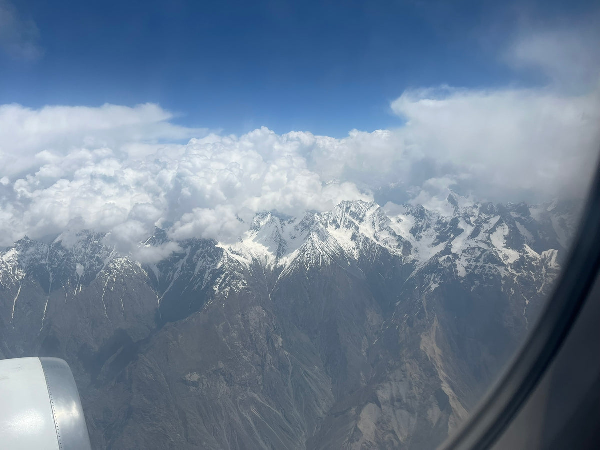 View of snow-capped mountains from an airplane window. Gilgit, Baltistan